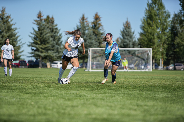 A UW student participates in a women's soccer match