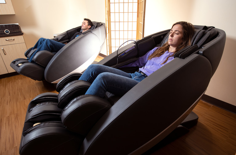 Students Utilize the Massage Chairs at Half Acre