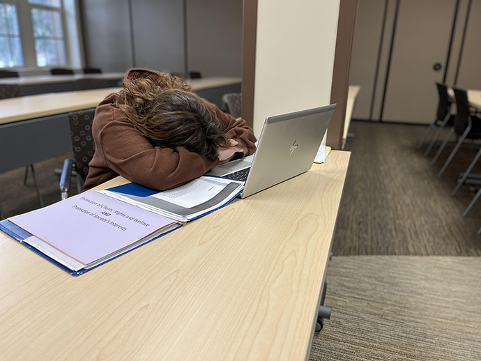 Student falls asleep while studying.