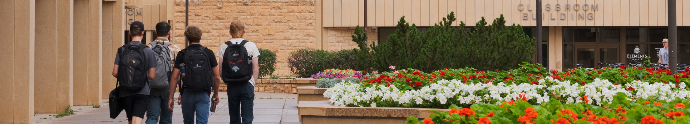 Students walking to the Classroom Building