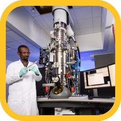 Scientist using an atomic-scale imaging machine