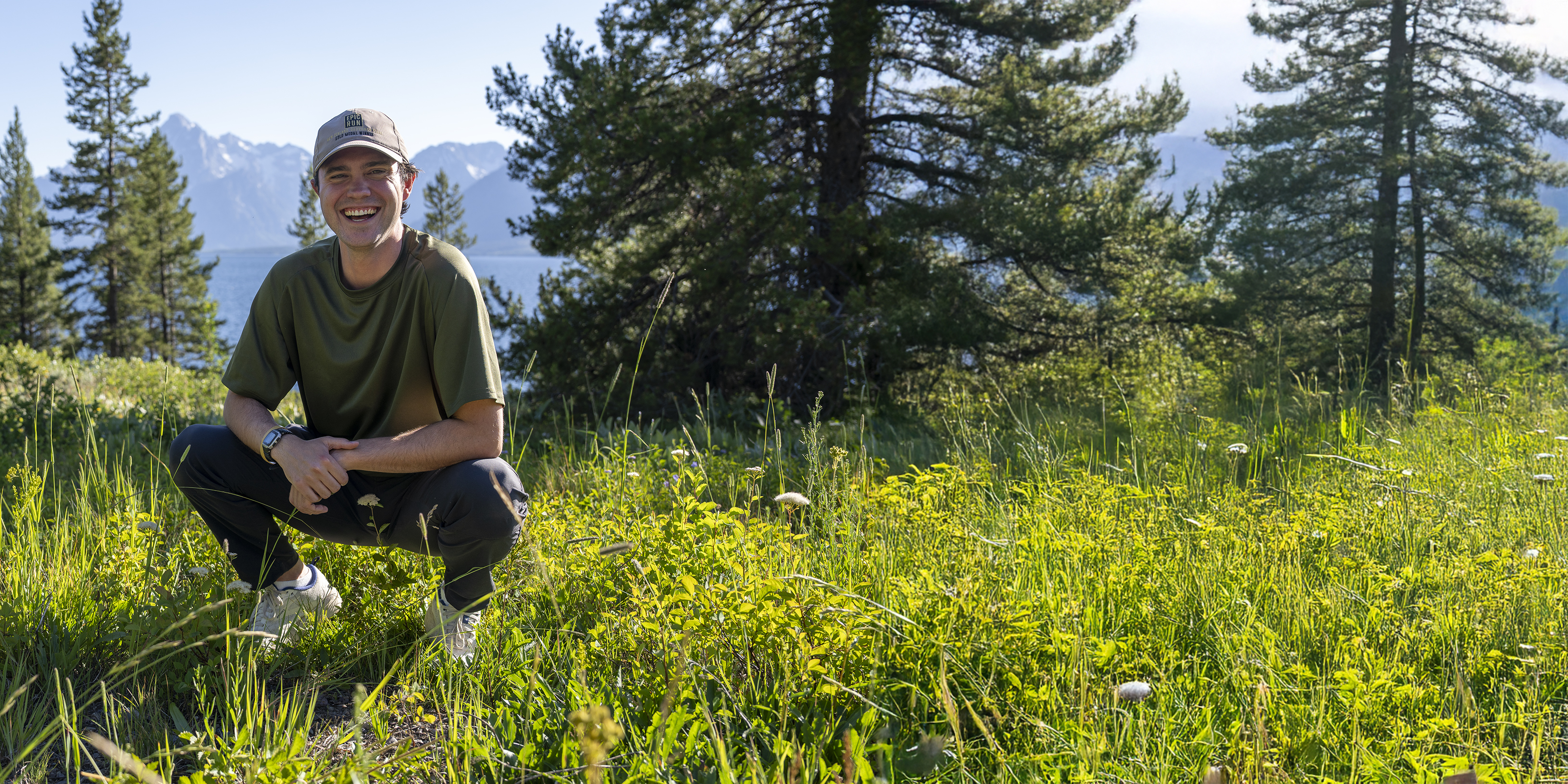 Caleb Hill at the AMK Ranch with Tetons in the background; photo credit Ali Grossman