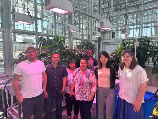 Dr. Wang visits with school teachers