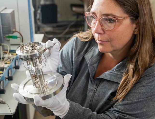 Researcher looking at lab equipment in the UW Stable Isotope Facility