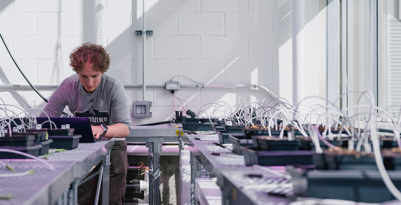 Caleb Hill at the AMK Ranch with Tetons in the background; photo credit Ali Grossman