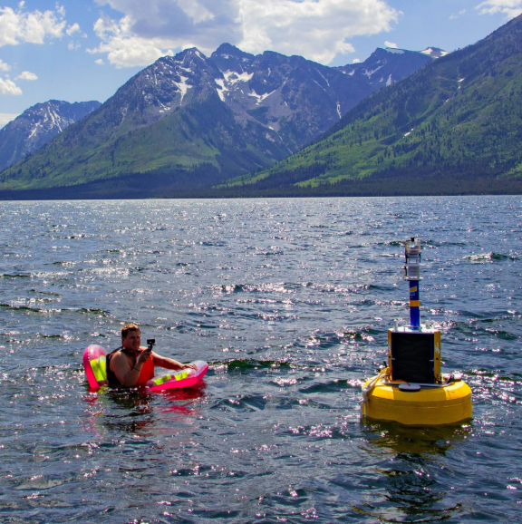 William Fetzer in Jackson Lake taking measurements