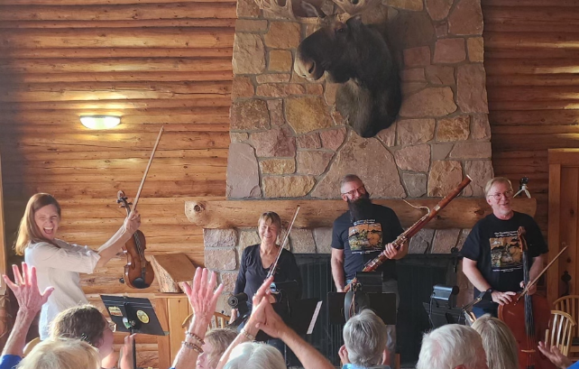 Musicians smiling after a performance