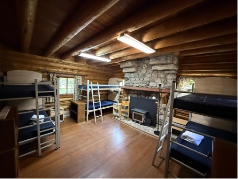 Johnson downstairs room with bunk beds and fireplace