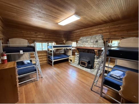 Johnson upstairs room with bunk beds and fireplace