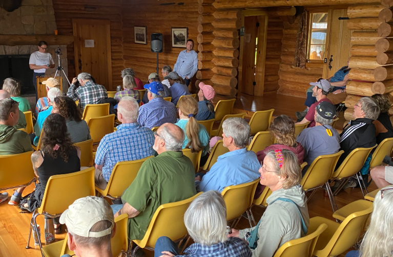A crowd gathers in Berol Lodge to watch William Fetzer give a seminar on fish in Jackson Lake