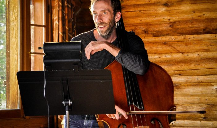 Image of a musician playing Bass at AMK Ranch