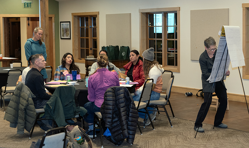 group of people discussing around a table
