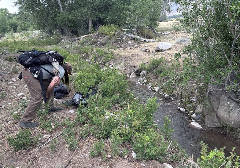 Cory Ott by a stream