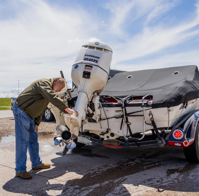 Man inspecting watercraft at an inspection station in Wyoming