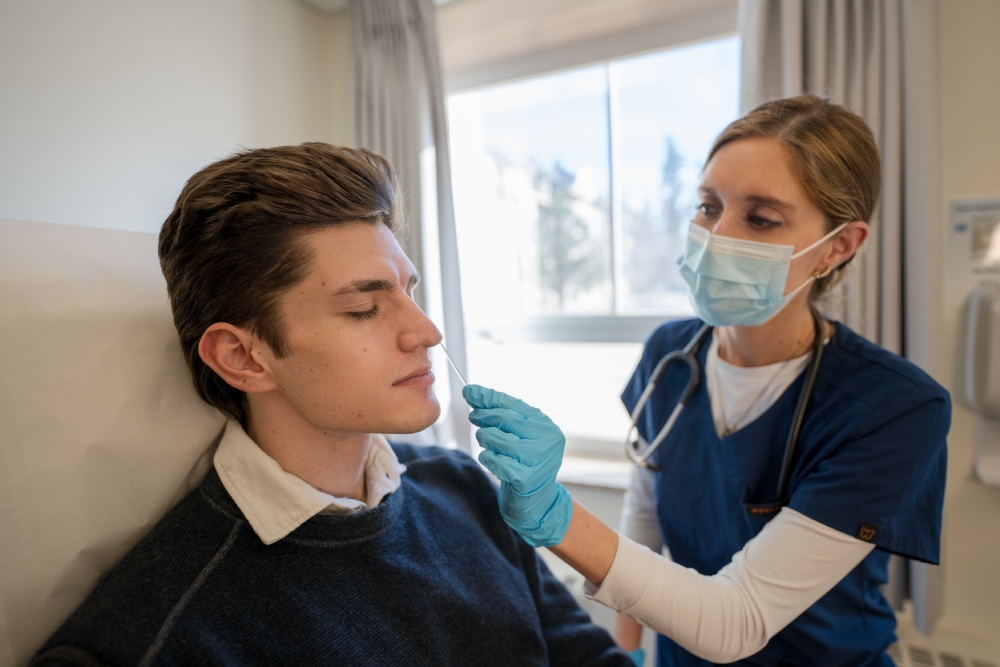 student gets nose swabed by healthcare individual