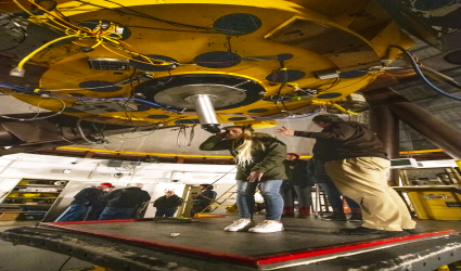 Research students using telescope 