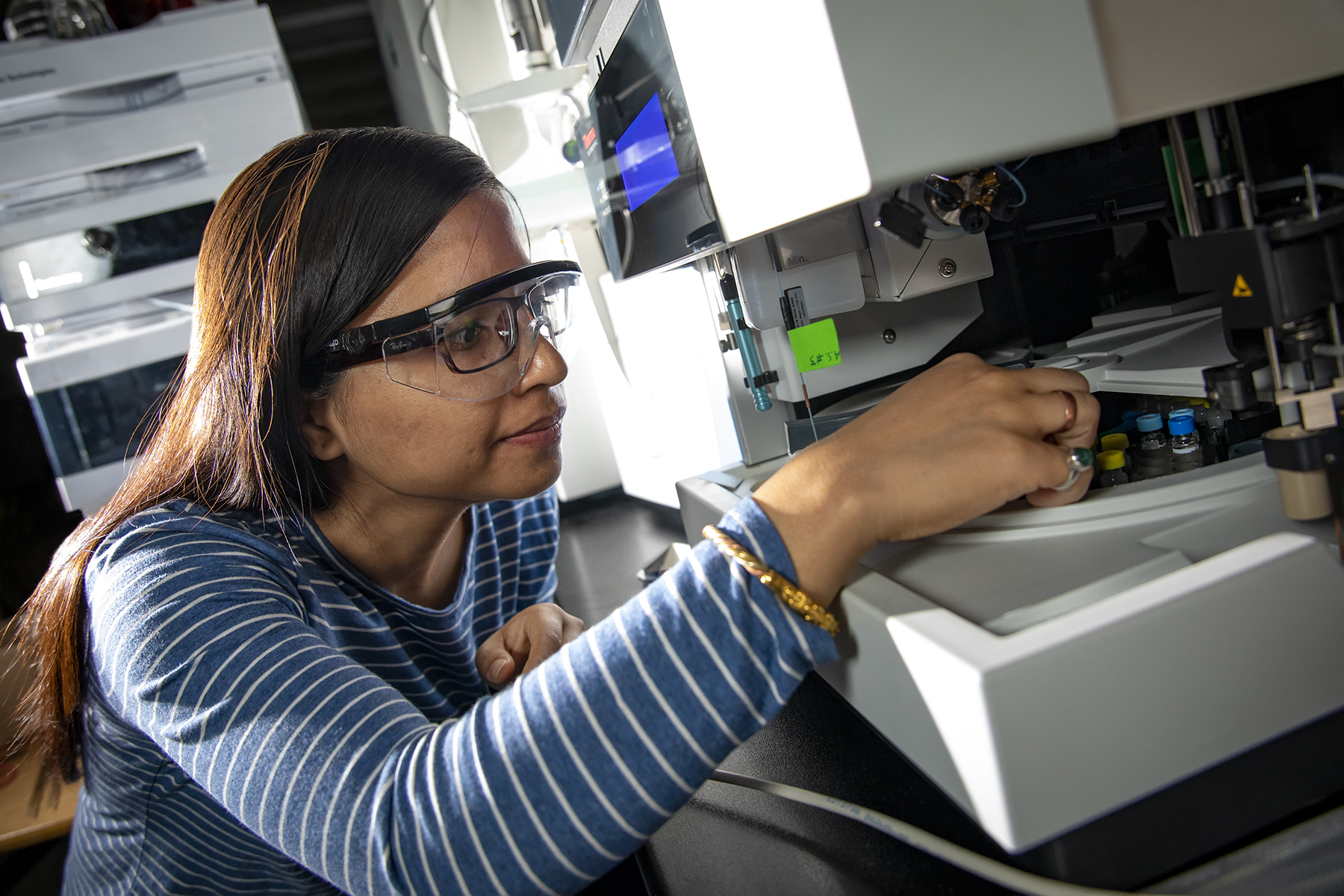 Kalpana Subedi is from Kathmandu, Nepal and is studying molecular and cellular life sciences. She works in a lab with a Mass Spectrometer machine that uses liquid chromatography to separate unknown compounds. It is used for detection and analysis of a wide range of compounds and small molecules and qualitative and quantitative analyses of samples. Her research involves studying the protein known as TraA. TraA is a cell surface localized protein in Myxococcus xanthus, a soil-dwelling bacteria exhibiting social behaviors associated with higher living organisms such as swarming, rippling, and fruiting bodies formation.