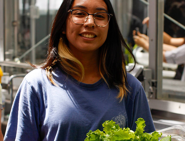 Woman holding lettuce