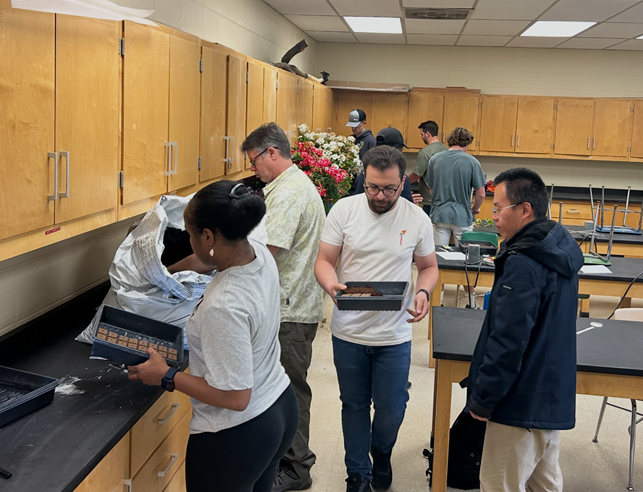 Students holding trays in classroom