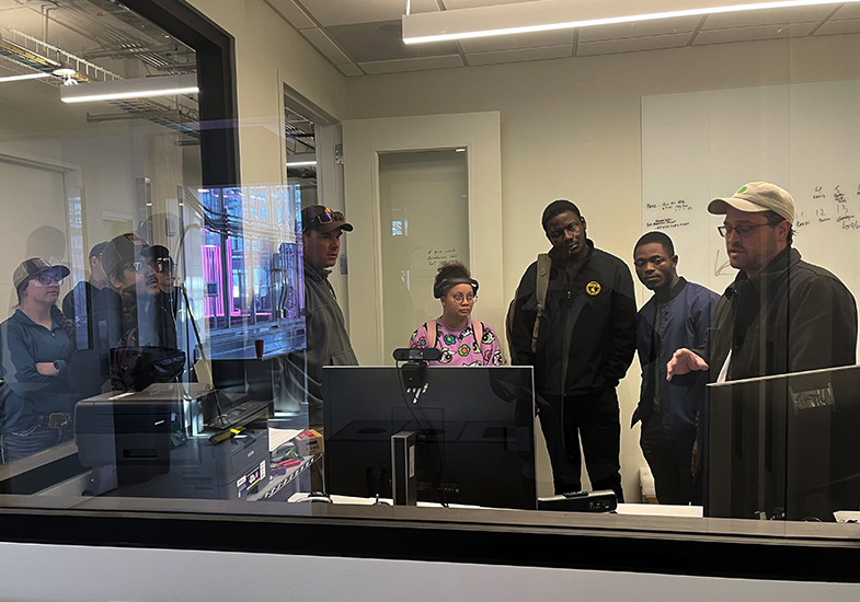 Researchers talking in front of computers