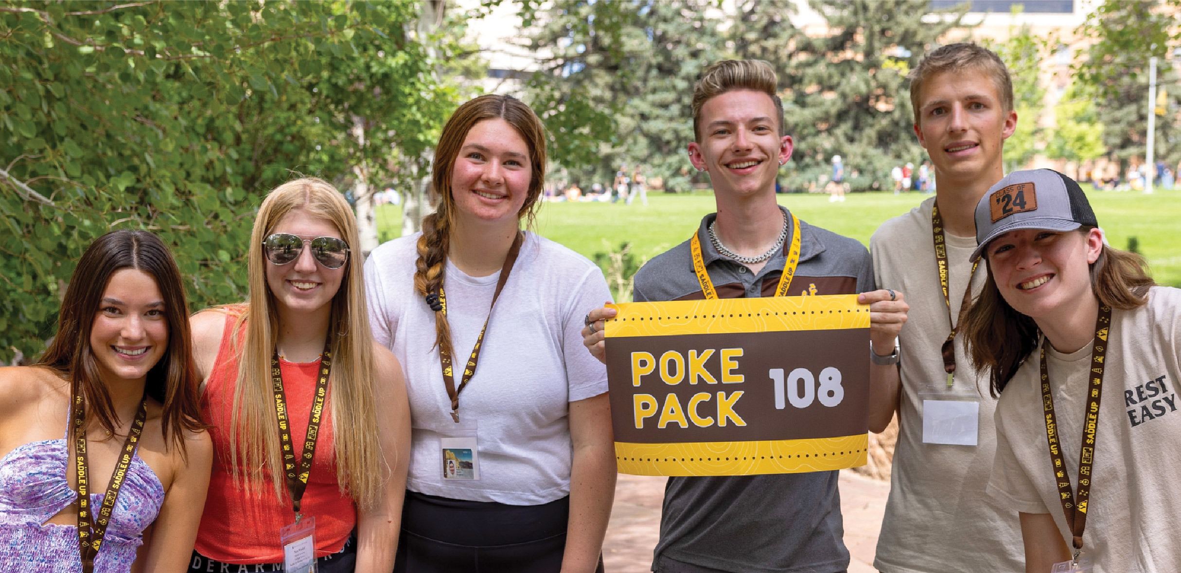 students holding a poke pack sign
