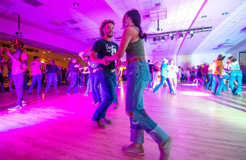 two students swing dance at saddle up