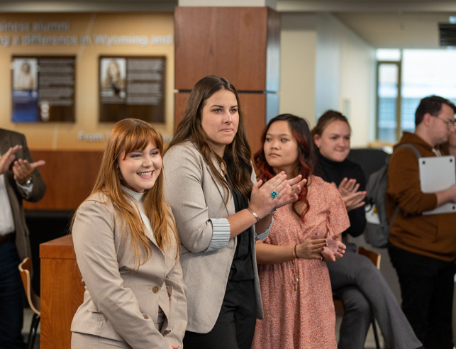 students smile at an event