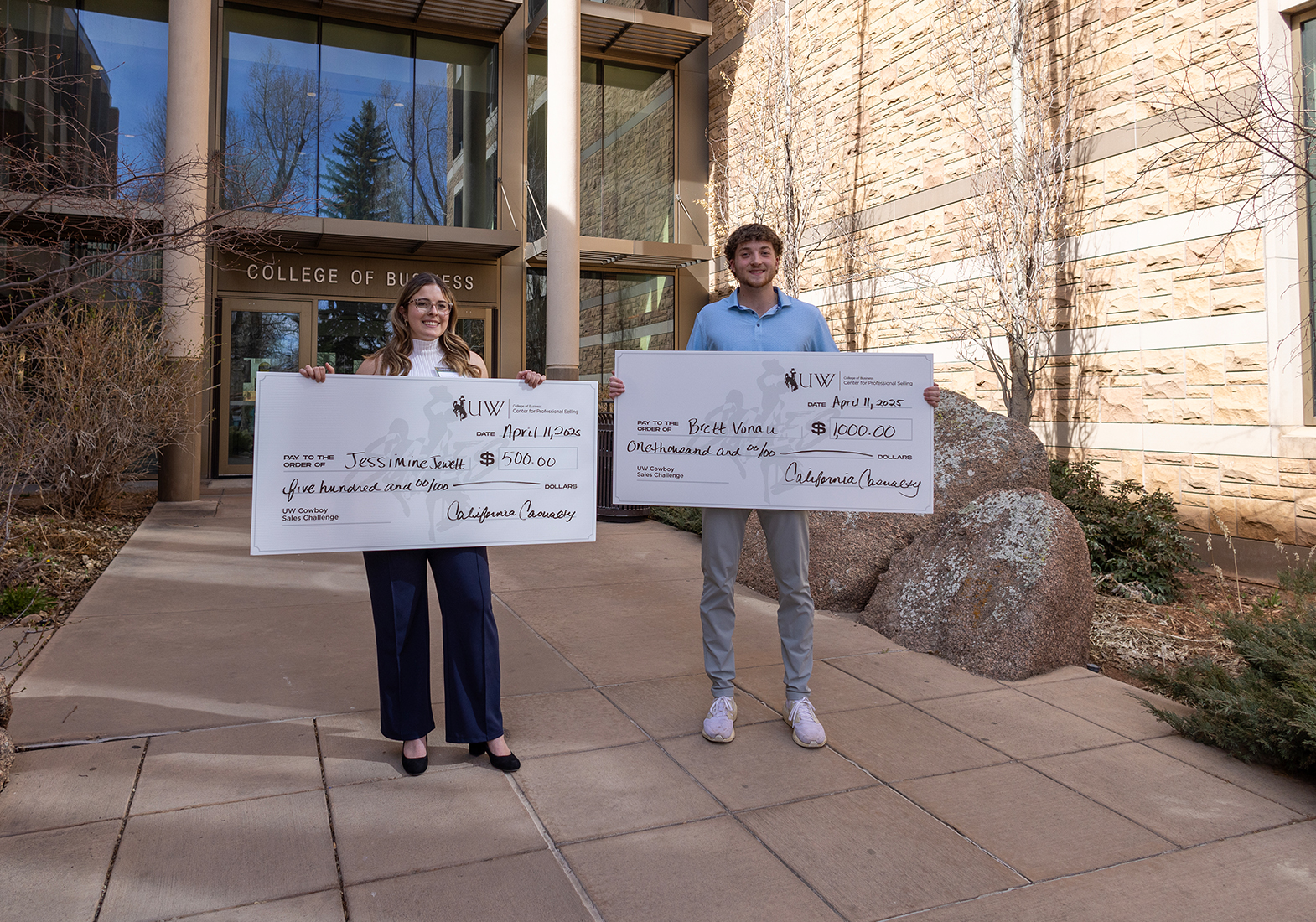 sales competiton winners with large checks
