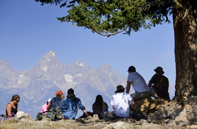 Group looking at Grand Tetons in distance