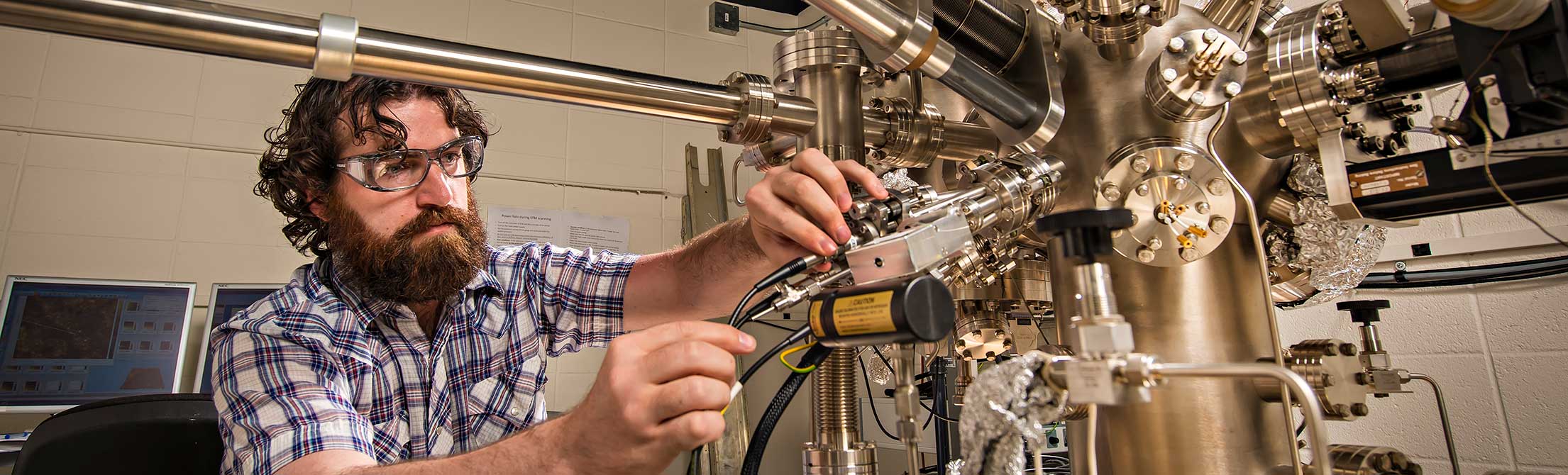UW researcher using scientific equipment