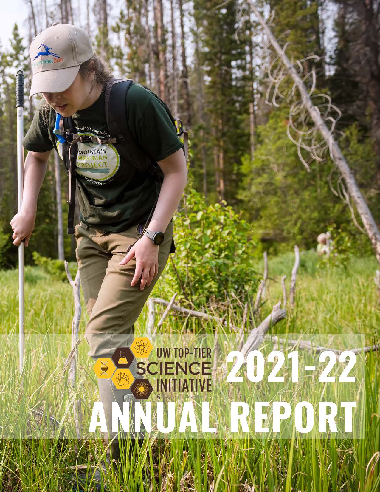 Front page of Si Annual Report 2021-22 Student doing research in alpine environment