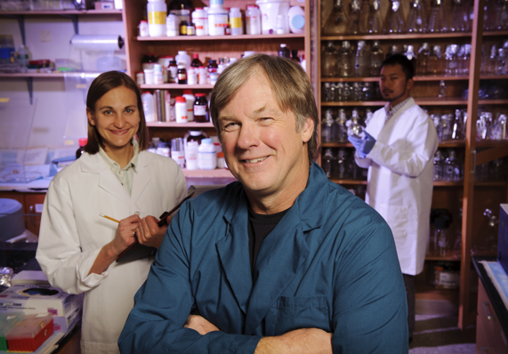 student and teacher in lab coats