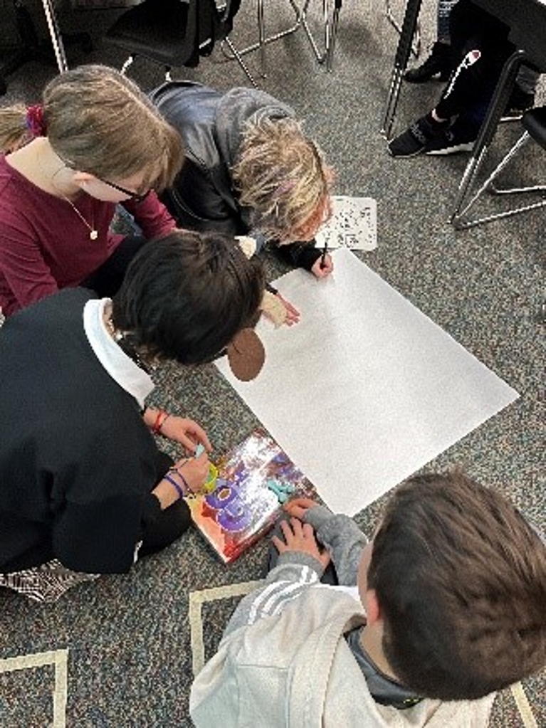 students working together in groups with their animal design