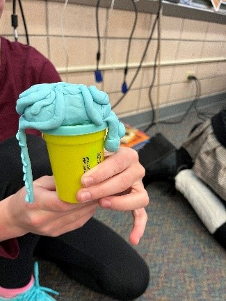 the beginnings of a brain being created with Play doh