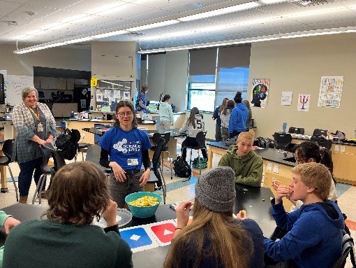 outreach assistant speaking with students