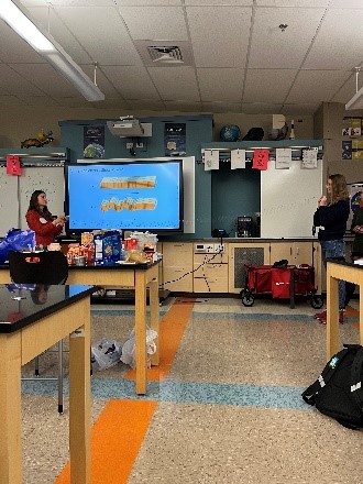 outreach assistants instructing on tectonic plates