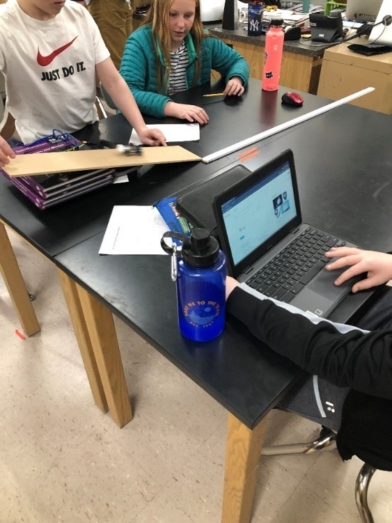 Students learning about physics at Cody Roadshow outreach