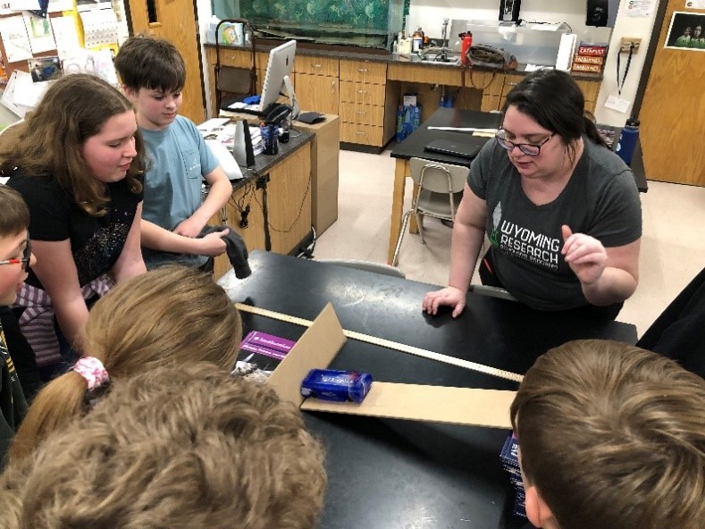 Students learning about physics at Cody Roadshow outreach