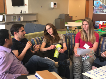 Ellen Aikens, second from right, engages in collaborative communication with her team at the 2019 Summer Institute in Sheridan, Wyoming.