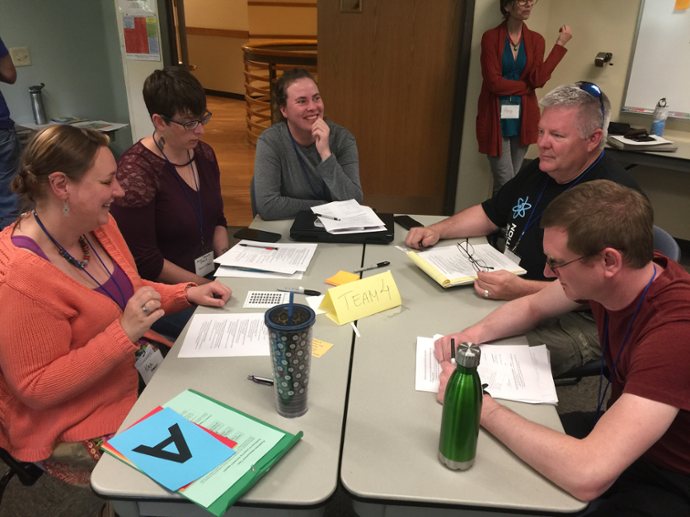 Libby works with her team of educators at the 2018 Summer Institute.