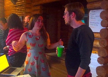 Jessica Sutter talking to Caleb Hill at a reception