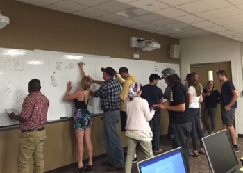 classroom with students at whiteboard