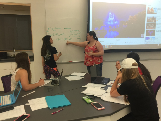 learning assistant using the whiteboard to draw out a concept