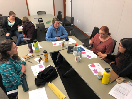 McKensie Harris (third from right) works with her team at a recent LAMP workshop.