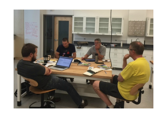 Elliott Hulley, Dave Anderson, Brian Leonard and John Hoberg of the Chemistry Department work together to develop instructional strategies during the 2016 Summer Institute on Active Learning in the Sciences