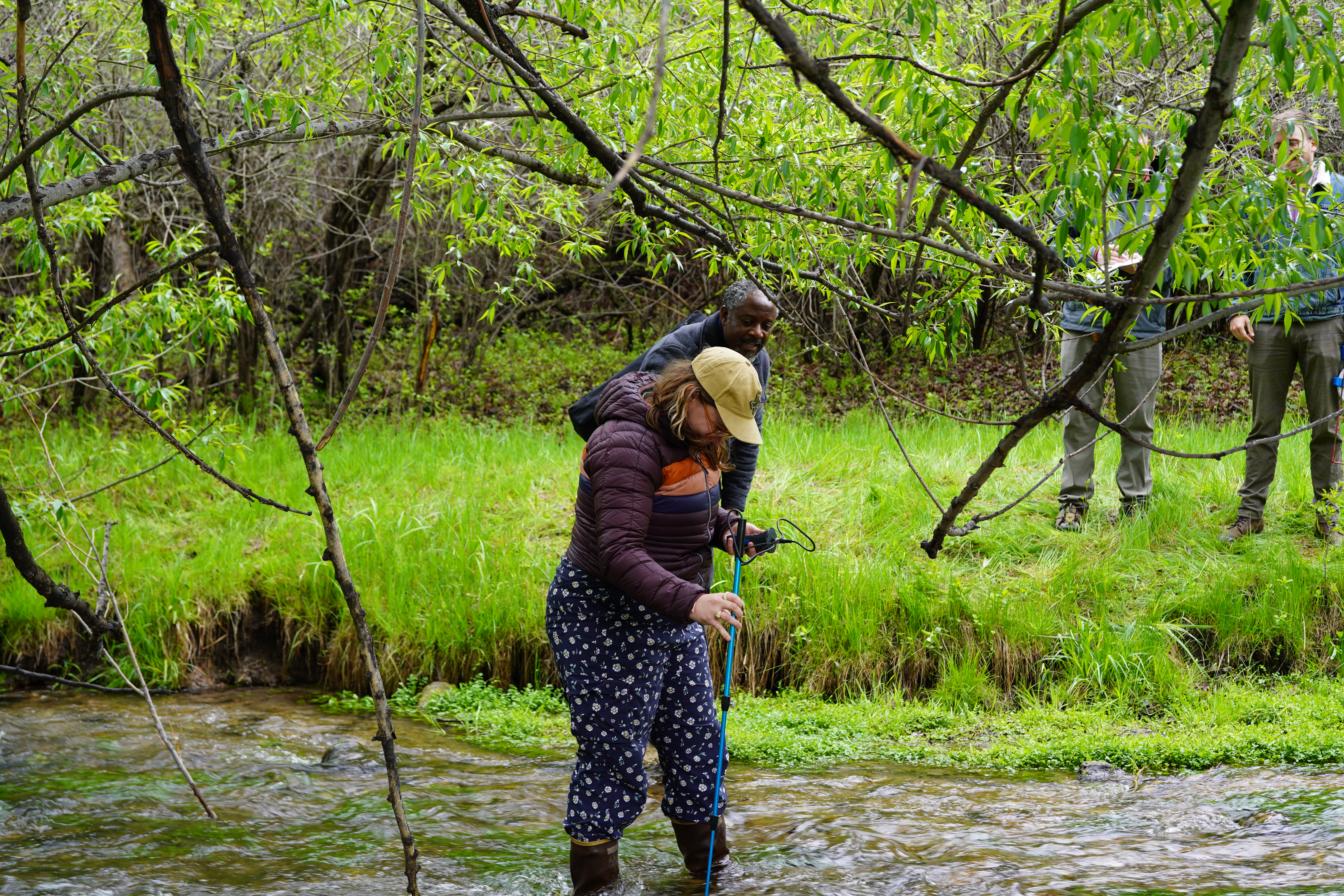 : Paddington Hodza and Casey Black take measurements in Sand Creek