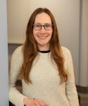 Scientist with glasses and white sweater