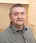Scientist with green/gray dress shirt