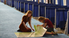 Students setting up science fair displays at the Intel International Science and Engineering Fair