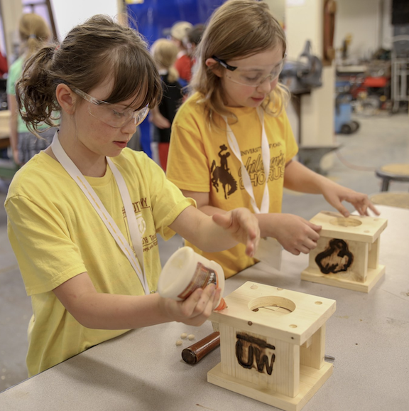 Two students work on a project